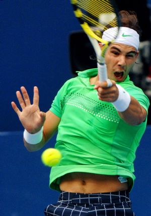 Rafael Nadal of Spain returns the ball during the men's singles semifinal match against Marin Cilic of Croatia at the China Open tennis tournament in Beijing, Oct. 10, 2009.(Xinhua/Gong Lei)