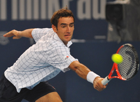 Marin Cilic of Croatia hits a return during the men's singles final match against Novak Djokovic of Serbia at the China Tennis Open Tournament 2009 in Beijing, Oct. 11, 2009. Cilic lost 0-2.[Luo Xiaoguang/Xinhua]