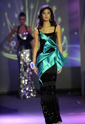 Tsira Suknidze in evening dress poses during the Miss Georgia 2009 in Batumi, Georgia, Oct. 11, 2009. Tsira Suknidze won the pageant on Sunday and will represent Georgia to attend the Miss World contest. [Xinhua] 