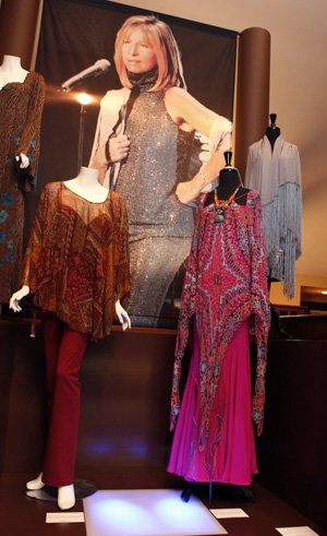 Costumes (bottom) worn during the film 'Meet the Fockers' and the shawl worn by singer Barbra Streisand at the Las Vegas New Year's Eve concert in 1999 (top) are shown at a press preview of items from the auction 'The Collection of Barbra Streisand' in Beverly Hills Oct. 12, 2009. Julien's Auctions will offer items collected by Streisand at an auction October 17 and 18, with proceeds going to The Streisand Foundation.[Xinhua/Reuters]