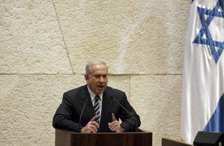 Israel's Prime Minister Benjamin Netanyahu speaks at the opening of the winter session of the Knesset, the Israeli parliament, in Jerusalem October 12, 2009. Netanyahu gave no ground on peace with the Palestinians in a speech on Monday, reasserting they must recognise Israel as a Jewish state if they wanted a deal for a state of their own. (Xinhua/Reuters Photo)