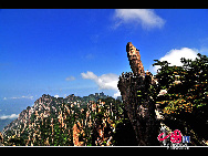 Mount Huang, also known as Huangshan is a mountain range in southern Anhui province in eastern China. The area is well known for its scenery, sunsets, peculiarly-shaped granite peaks, Huangshan Pine trees, and views of the clouds from above. Mount Huang is a frequent subject of traditional Chinese paintings and literature, as well as modern photography. [Photo by Liu Xingguo]