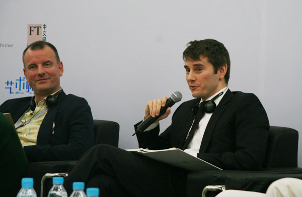 Nick Simunovic (right), director of Gagosian Gallery Hong Kong, gives a speech at the Global Collecting Forum on October 11, 2009 in Beijing.