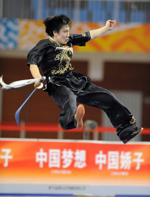 Liu Xiaolei from Beijing competes during the saberplay competition of women's individual all-around event for saberplay and cudgelplay in martial arts at China's 11th National Games in Binzhou, east China's Shandong Province, Oct. 14, 2009. Liu got 9.66 points in the saberplay and ranked the second place with 19.45 points in total. [Xu Yu/Xinhua]