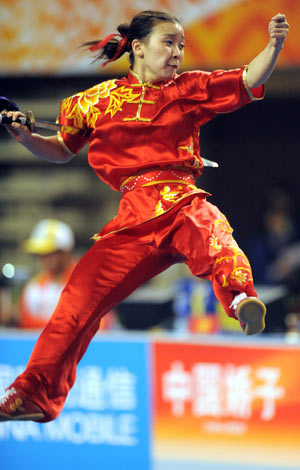 Ma Lan from Henan competes during the saberplay competition of women's individual all-around event for saberplay and cudgelplay in martial arts at China's 11th National Games in Binzhou, east China's Shandong Province, Oct. 14, 2009. Ma got 9.71 points in the saberplay and ranked the third place with 19.42 points in total. [Xu Yu/Xinhua] 