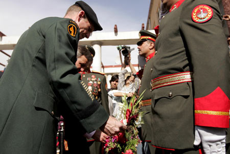 Supreme commander of NATO-led international forces in Afghanistan, U.S. General Stanley Mc Chrystal (L) lays a wreath flower during a ceremony commemorating dead Afghan armed force in Kabul, capital of Afghanistan, Oct. 14, 2009. [Zabi Tamanna/Xinhua] 