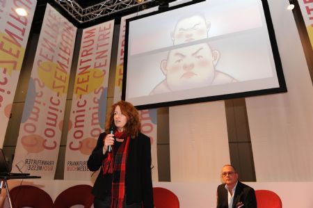 German journalist Francoise Hauser introduces Chinese cartoons during the cartoon forum at the 61st Frankfurt Book Fair in the central German city of Frankfurt, Oct. 14, 2009.