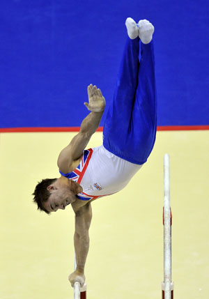 Silver medalist Daniel Keatings of Britain competes on the parallel bars during Men's Individual All-Around final of the 41st Artistic Gymnastics World Championships in London, Britain, Oct. 15, 2009. [Wang Yuguo/Xinhua]