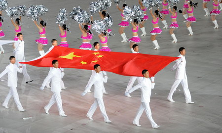 Eight flag-bearers march on at the opening ceremony of the 11th National Games held in Jinan, Shandong Province Oct 16, 2009. [Xinhua]