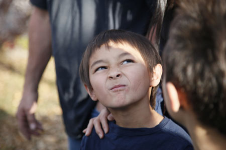 Six-year-old Falcon Heene squints up at a news helicopter hovering over his house in Fort Collins, Colorado Oct. 15, 2009. [Xinhua/Reuters]