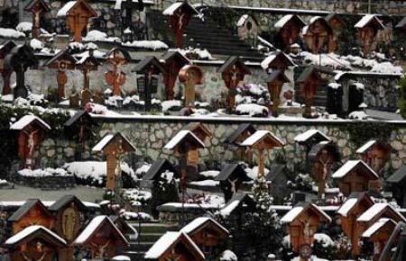 Snow-covered crosses are pictured in a graveyard in Grainau near Garmisch-Partenkirchen, Germany.[CCTV] 