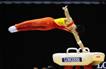 Gold medalist Zhang Hongtao of China competes during Pommel Horse final of the 41st Artistic Gymnastics World Championships in London, Britain, Oct. 17, 2009. (Xinhua/Zeng Yi) 
