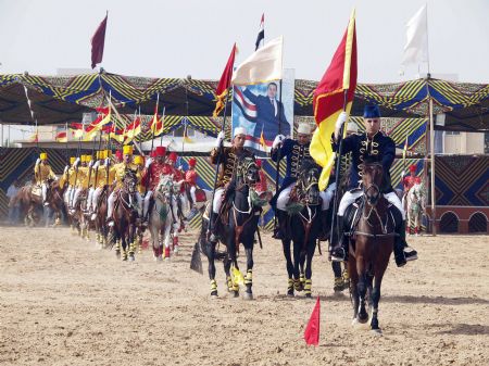 Arabian horses march during the El-Sharkia 18th Arab Horse Festival in the Egyptian town of Belbies, 100 km north of Cairo, Oct. 17, 2009.[Xinhua]