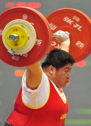 Qi Xihui of Hunan competes during the women's weightlifting over 75kg division in the 11th Chinese National Games in Jinan, east China's Shandong Province, Oct. 20, 2009. Qi won the gold medal with a total of 324kg. [Xinhua]