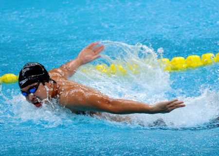  Zhejiang's Wu Peng competes during the men's 200m butterfly final at the 11th Chinese National Games in Jinan, east China's Shandong Province, Oct. 20, 2009. Wu clocked 1 minute 54.40 seconds to win the title. [Xinhua]
