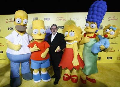 Matt Groening (C), creator of The Simpsons, poses with characters from the show (L-R) Homer, Bart, Lisa, Marge and Maggie at the 20th anniversary party for the television series at Barker hangar in Santa Monica, California October 18, 2009. [CCTV via Agencies] 