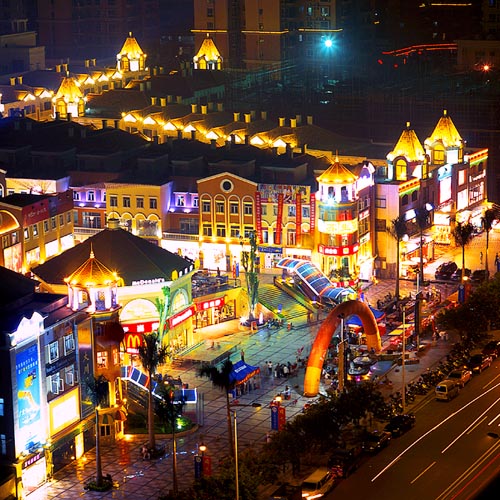 Dongguan's central business district shows off its bright lights. Dongguan, which has a population of 7 million and is 100 kilometers from Hong Kong, owes much of its prosperity to contract manufacturing for major brands and multinationals. [File photo]