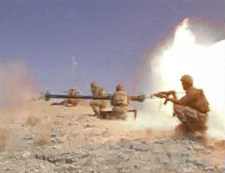 Pakistani soldiers fire an anti-tank gun during a battle between Pakistani security forces and Taliban in the South Waziristan region in this image taken from a video grab released by the Pakistani military on October 21, 2009.