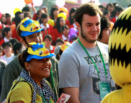 Foreigners in cartoon headwear visit a cartoon creative industry fair held in Wuhu, east China's Anhui Province, Oct. 23, 2009. The 2nd China International Cartoon Creative Industry Fair kicked off at Wuhu International Exhibition Center on Friday, attracting 238 enterprises and organizations from home and abroad. [Xinhua]