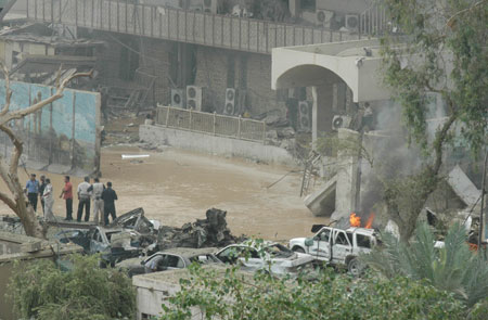 The photo taken on Oct. 25, 2009 shows the site of a suicide attack near the building of Baghdad provincial council in Baghdad, capital of Iraq. At least 62 people were killed and 180 others injured in two car bomb explosions which rocked central Baghdad on Sunday. (Xinhua/Gao Shan)