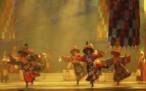 Dancers of Xigaze Ethnic Art Troupe perform the Tibetan song and dance drama 'Rainbow of Qomolangma' at Shanghai's Majestic Theater on October 23, 2009. 