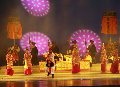 Dancers of Xigaze Ethnic Art Troupe perform the Tibetan song and dance drama 'Rainbow of Qomolangma' at Shanghai's Majestic Theater on October 23, 2009. 