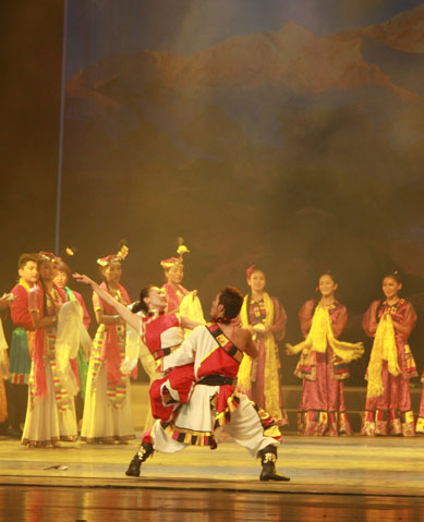 Dancers of Xigaze Ethnic Art Troupe perform the Tibetan song and dance drama 'Rainbow of Qomolangma' at Shanghai's Majestic Theater on October 23, 2009.