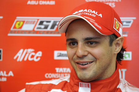 Ferrari Formula One driver Felipe Massa of Brazil smiles after driving a F2007 car during a test at the team's Fiorano track October 12, 2009.(Xinhua/Reuters File Photo)