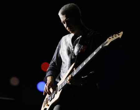 Bassist Adam Clayton of the rock band U2 performs during a concert at Rose Bowl in Pasadena, California October 25, 2009.(Xinhua/Reuters Photo)