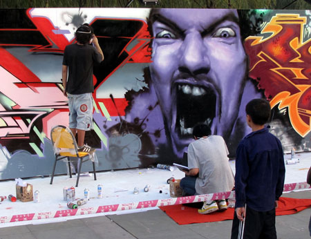 Contestants scrawl their creations during a contest held in Wuhan, capital of central China