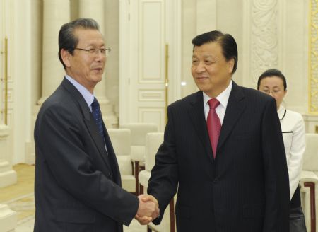Liu Yunshan (R), head of the Publicity Department of the Communist Party of China (CPC) Central Committee and also a member of the Political Bureau and Secretariat of the CPC Central Committee, meets with a delegation headed by Choe Tae Bok, secretary of the Central Committee of the Worker's Party of Korea (WPK) of the Democratic People's Republic of Korea (DPRK), in Beijing, capital of China, on Oct. 27, 2009. (Xinhua/Li Xueren)