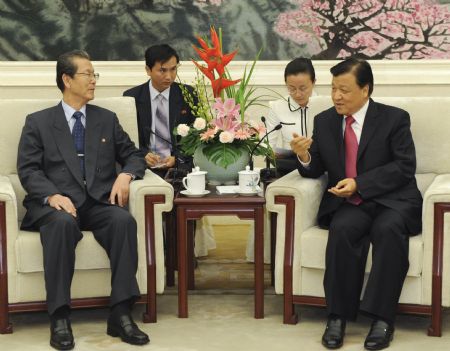 Liu Yunshan (R, Front), head of the Publicity Department of the Communist Party of China (CPC) Central Committee and also a member of the Political Bureau and Secretariat of the CPC Central Committee, meets with a delegation headed by Choe Tae Bok (L, Front), secretary of the Central Committee of the Worker's Party of Korea (WPK) of the Democratic People's Republic of Korea (DPRK), in Beijing, capital of China, on Oct. 27, 2009. (Xinhua/Li Xueren) 