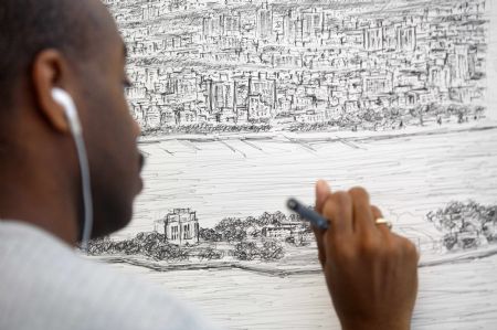 British artist Stephen Wiltshire works on a hand-drawn panorama of the skyline of New York, from a studio at the Pratt Institute in Brooklyn October 28, 2009.(Xinhua/Reuters Photo)