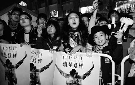 Michael Jackson fans gather at Solana Plaza in Beijing for the premiere of the movie. 