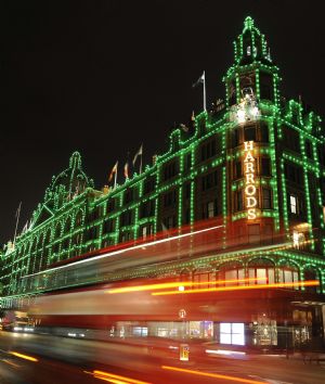 A bus passes the Harrods retail store in London October 29, 2009. The world-famous department store's 11 500 white light bulbs have been changed to green bulbs for this year's Christmas lights display.(Xinhua/Reuters Photo)