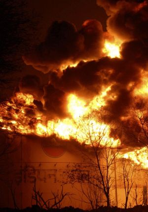 Huge flames are seen coming out of an oil depot, in Jaipur, India, Thursday, Oct. 29, 2009.(Xinhua/Reuters Photo)