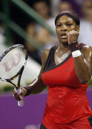 Serena Williams of the U.S. celebrates match point against her sister Venus Williams during their WTA Championships final tennis match in Doha November 1, 2009.(Xinhua/Reuters Photo)