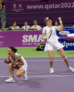 Maria Jose Martinez Sanchez (R) and compatriot Nuria Llagostera Vives of Spain jubilate for the victory against Cara Black of Zimbabwe and Liezel Huber of the U.S. during the final match of women's doubles at the WTA Tour Championships in Doha, Qatar, Nov. 1, 2009.(Xinhua/Chen Shaojin)