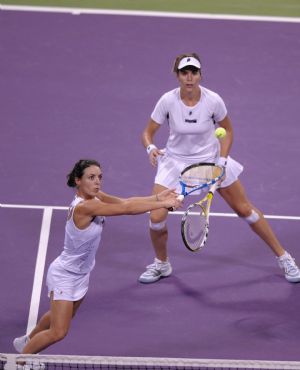 Maria Jose Martinez Sanchez (top) and compatriot Nuria Llagostera Vives of Spain compete during the final match of women's doubles against Cara Black of Zimbabwe and Liezel Huber of the U.S. at the WTA Tour Championships in Doha, Qatar, Nov. 1, 2009.(Xinhua/Chen Shaojin)