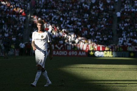 Los Angeles Galaxy's David Beckham walks on the field during Game 1 of their MLS Cup western conference semifinal soccer playoff series against Chivas USA in Carson, California, November 1, 2009.