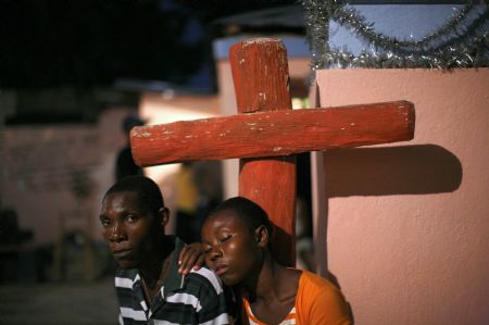 Haitians take part in a voodoo ceremony inside a voodoo temple during Day of the Dead celebrations in Belladere November 2, 2009.