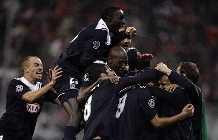 Bordeaux players react after fellow team member Marouane Chamakh scored a goal during their Group A Champions League soccer match against Bayern Munich in Munich, southern Germany, Tuesday, Nov. 3, 2009. Bordeaux won the match 2-0. (Xinhua/Reuters Photo) 