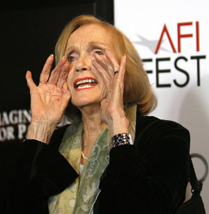 Cast member Eva Marie Saint shouts at photographers as she arrives for a screening for the 50th anniversary of Alfred Hitchcock