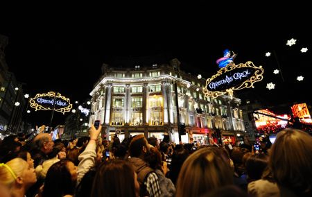 People gather at the intersection of the Oxford Street, the Regent Street celebrating for Christmas lights switched on in London, capital of Britain, on Nov. 3, 2009. The annual Christmas Lights Switch-on ceremonies were held on the Oxford Street, the Regent Street and the City of London on Tuesday evening, marking the launch of this year's Christmas shopping season. (Xinhua/Zeng Yi)