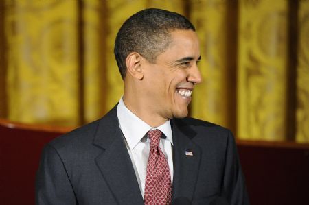 U.S. President Barack Obama smiles as he welcomes guests for an evening of classical music in the East Room of the White House in Washington, November 4, 2009.