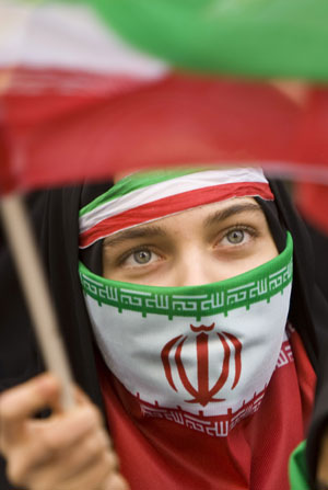 A student waves the Iranian flag during a rally outside the former U.S. embassy in Tehran November 4, 2009. (Xinhua/Reuters Photo)