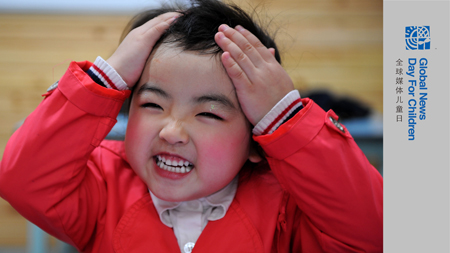 Song Xinyi, an earthquake orphan, smiles in her kindergarten in Chengdu, capital city of southwest China's Sichuan Province, on Oct. 26, 2009. 