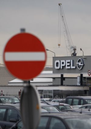 A road sign is seen at the entrance of the Opel assembly plant in Antwerp November 5, 2009. The board of General Motors has opted to keep Opel, undoing months of painstaking negotiations to sell the European unit to a Russian-backed group led by Canada's Magna.