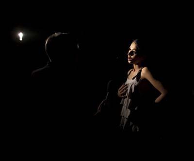Pakistani model Iraj is photographed giving an interview during a power outage at Fashion Pakistan Fashion Week on November 4, 2009.(Xinhua/Reuters Photo)