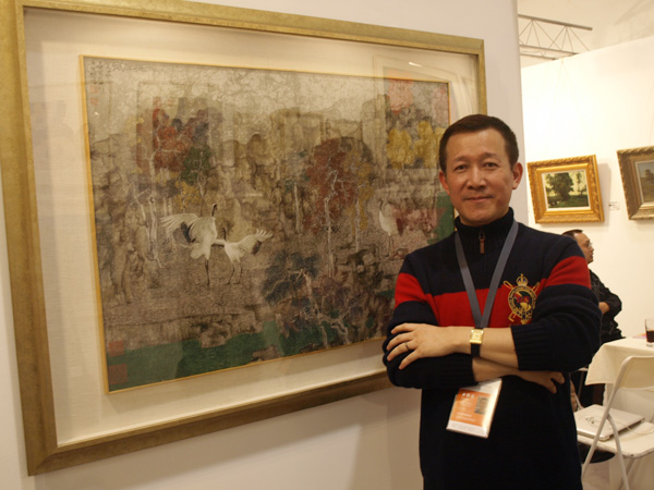 Director Chang Yih-chyun of Taiwan's Chuan Cheng Art Center and 'the White Cranes in Red Maples' by artist Zheng Li. 